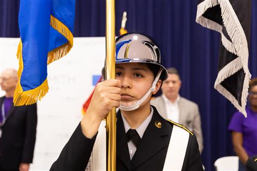 JROTC student holding flag